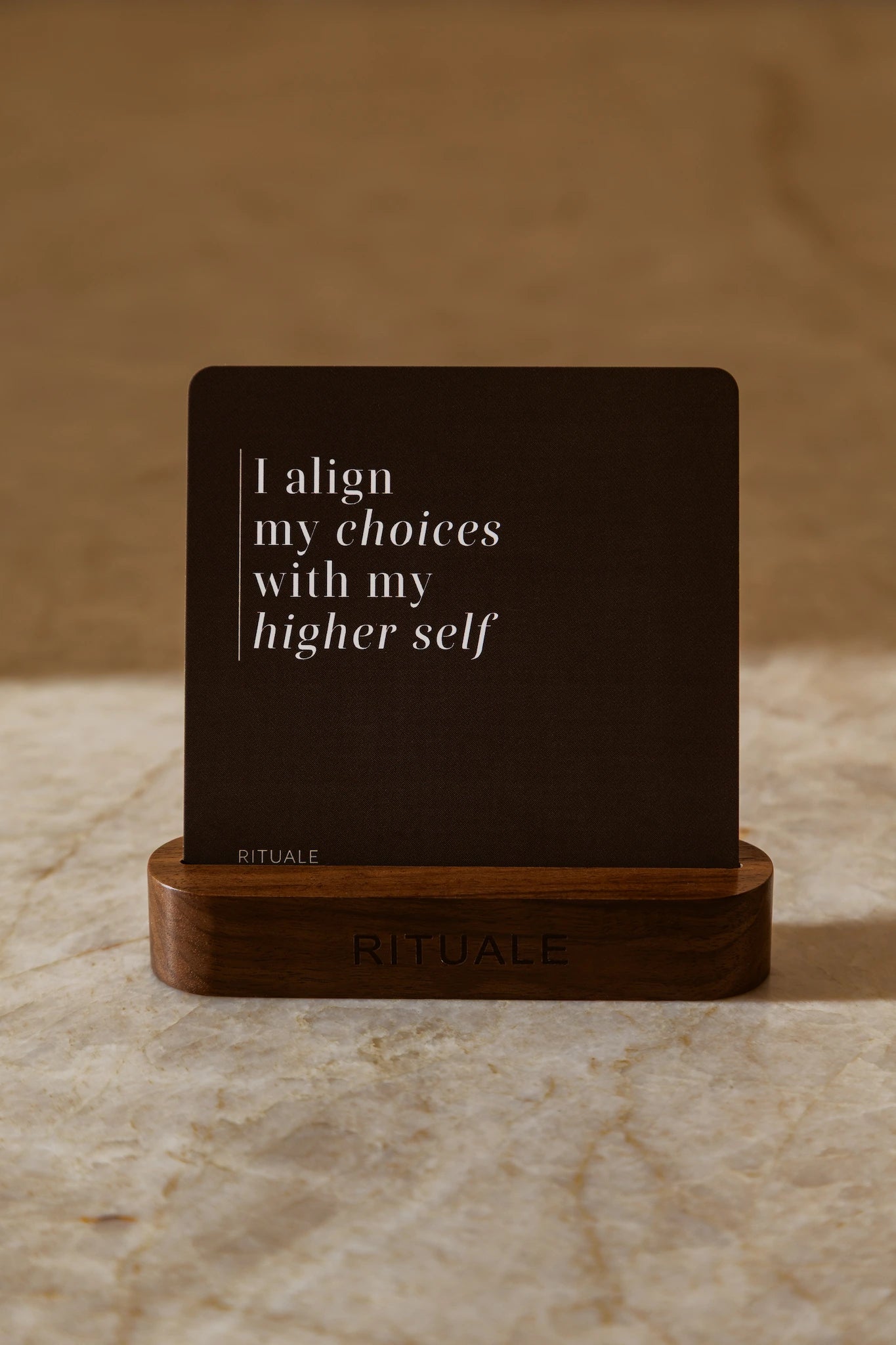 Rituale affirmation card reading "I align my choices with my higher self" in wooden display stand